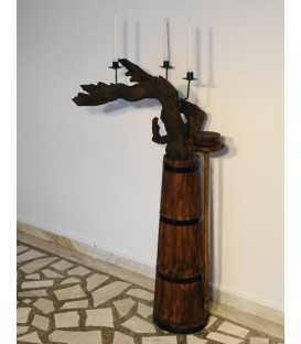 Candle holder formed of a tree root and an old butter churn